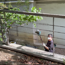 Jovant cordless pole angle grinder for DIY metal renovation on outdoor fencegrinder