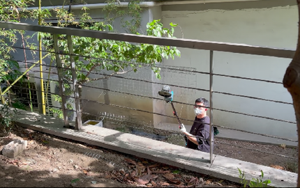 Jovant cordless pole angle grinder for DIY metal renovation on outdoor fencegrinder